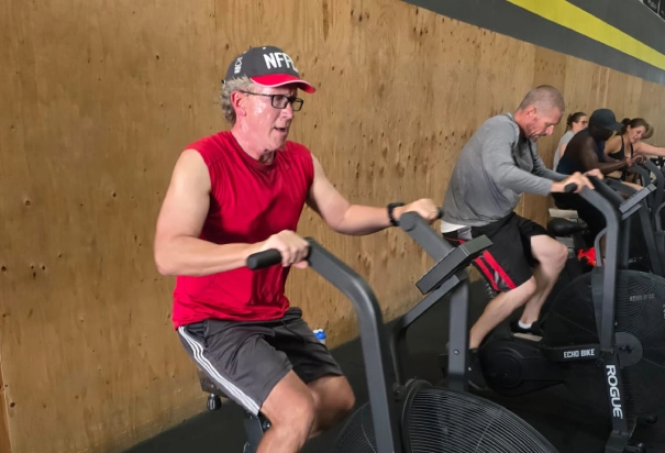 old man ride gym bike